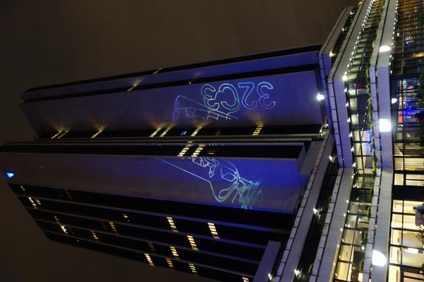 32C3 logo projected over the radisson blu hotel in Hamburg.